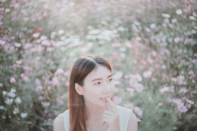 Portrait of beautiful young woman looking away