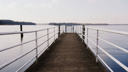 Pier over sea against sky