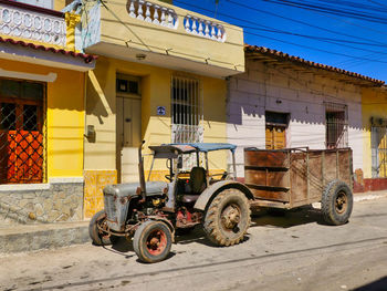 Vintage car on street against buildings