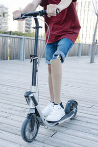 Disabled man riding electric scooter