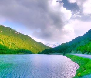 Scenic view of lake and mountains against sky