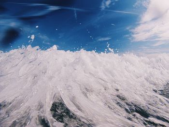 Close-up of wave against sky