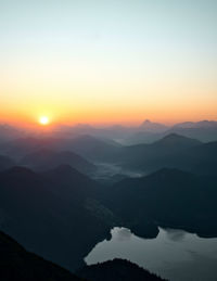 Scenic view of silhouette mountains against sky during sunset