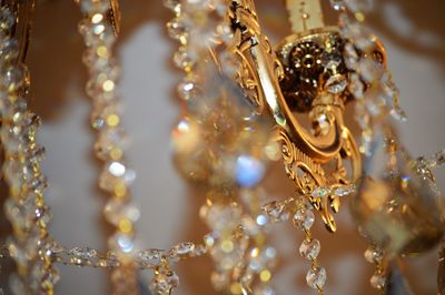 Close-up of chandelier hanging on ceiling