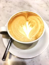 High angle view of cappuccino on table