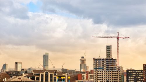 Modern buildings against sky in city