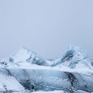 Snowcapped mountains against clear sky