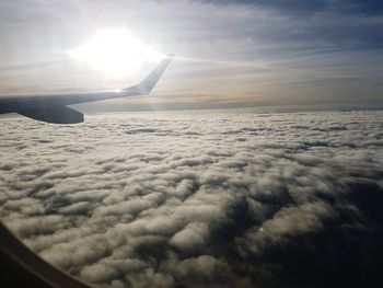 Cropped image of airplane over sea