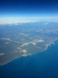 Aerial view of sea and landscape against sky
