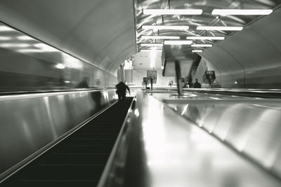 People on escalator at subway station