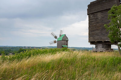 Old wooden windmill in the field