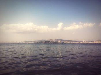 View of calm sea against cloudy sky