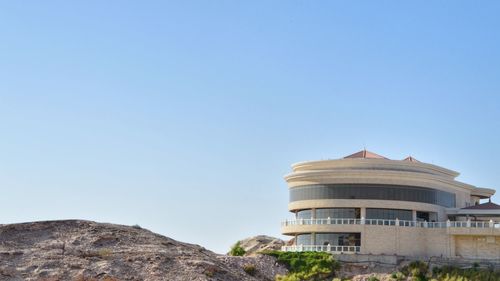 Low angle view of historical building against blue sky