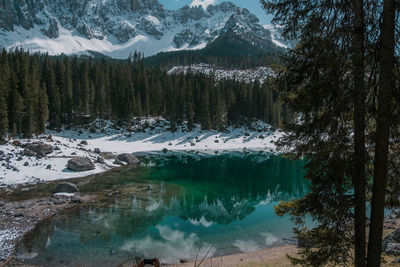 Scenic view of snowcapped mountains and lake during winter