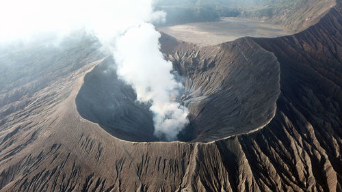 High angle view of volcanic mountain against sky