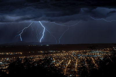 Aerial view of illuminated cityscape at night