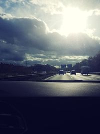 Cars on road against sky