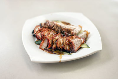 Close-up of meat in plate on table