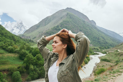 Young woman standing on mountain