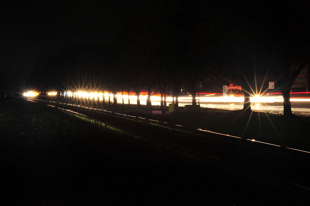 LIGHT TRAILS ON RAILROAD TRACK