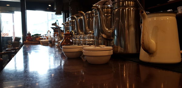 Glass of bottles on table in restaurant