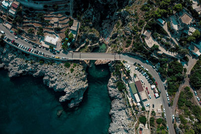 Aerial view of street by sea in town