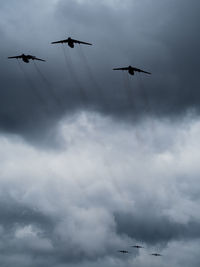 Low angle view of airplane flying in sky