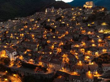 High angle view of illuminated buildings in city