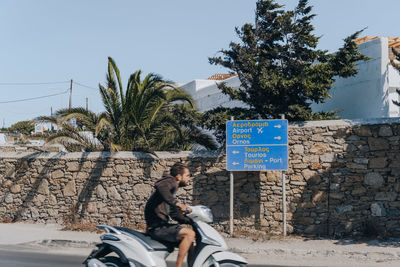 Man riding horse cart on street