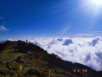 Scenic view of mountain against blue sky