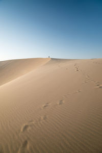 Scenic view of desert against clear sky