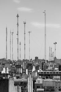 Communications towers and buildings against sky