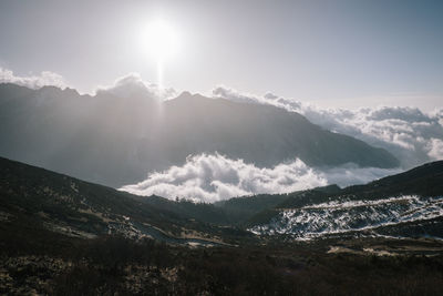 Scenic view of snowcapped mountains against sky