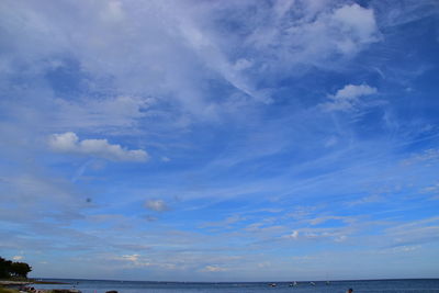 Scenic view of sea against blue sky