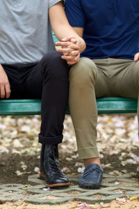 Low section of man sitting on field