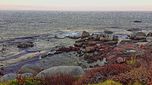 Scenic view of sea against sky at sunset