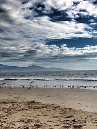 Scenic view of sea against cloudy sky