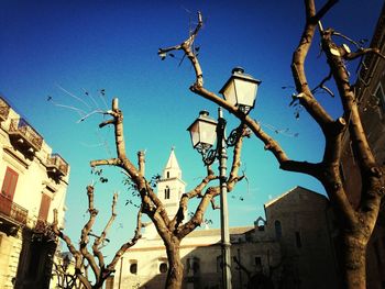 Low angle view of building against clear blue sky