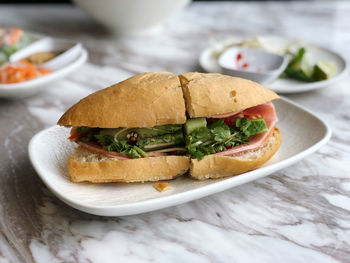 Close-up of burger in plate on table