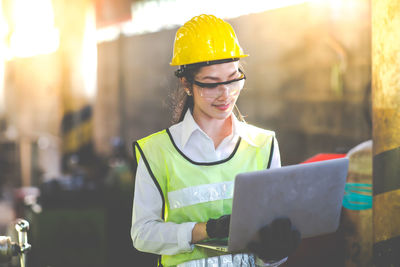 Portrait of woman working with mobile phone