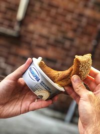 Close-up of hand holding ice cream
