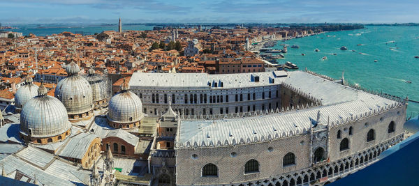 High angle view of townscape by sea