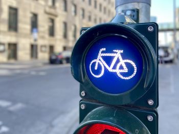 Close-up of bike symbol on road light