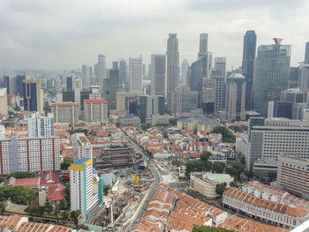 High angle view of buildings in city against sky