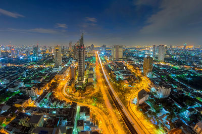 High angle view of illuminated buildings in city at night