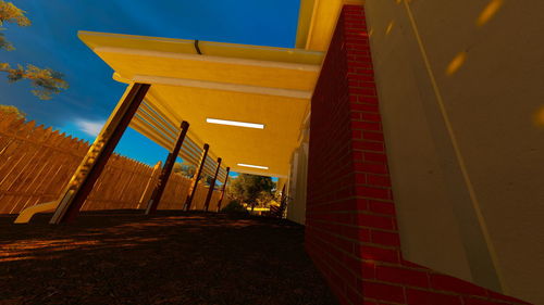 Low angle view of illuminated building against sky