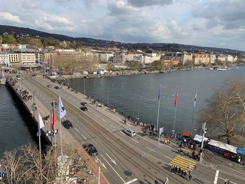 High angle view of city by road against sky