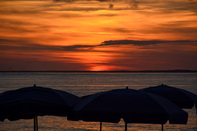 Scenic view of sea against orange sky