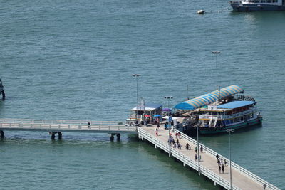 High angle view of people on pier at sea