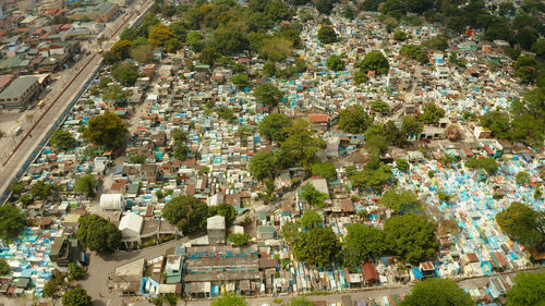 Famous cemetery in the city of manila, where people live among the graves and crypts top view. 